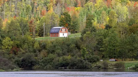 Getty Images Foliage with red barn Coos County New Hampshire