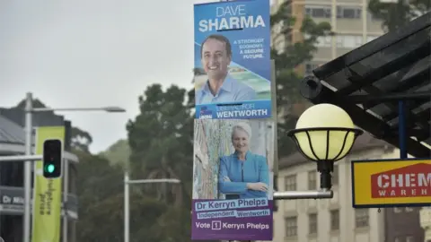 AFP/Getty Campaign posters ahead of the Wentworth by-election 2018