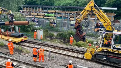 Network Rail Workers repairing a railway track