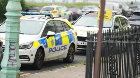 Eddie Mitchell Two police cars seen at the scene of a stabbing incident in Percival Terrace, near Marine Parade in Brighton, East Sussex.