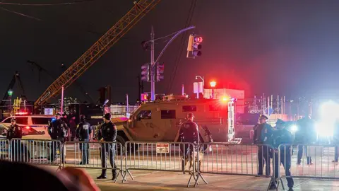 Getty Images NYPD officers and an armoured vehicle.