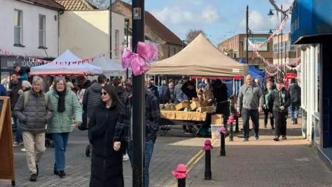 Maggie Canon People walking in Nailsea's high street where market stalls have filled the road