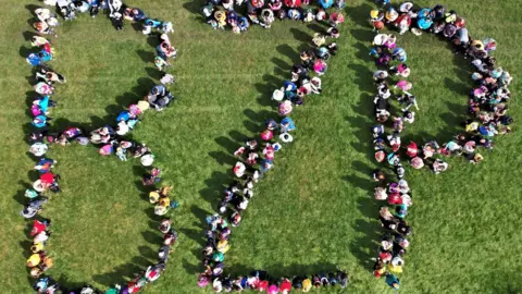 Matt Rolley Hundreds of people marking the letters BZP