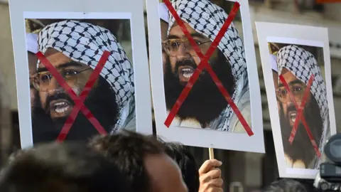 Getty Images Indian activists carry placards of the chief of Jaish-e-Mohammad, Maulana Masood Azhar during a protest against the attack on the air force base in Pathankot, in Mumbai on January 4, 2016