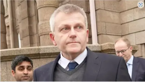 Deputy Ozouf stepping out of court after being sentenced to 120 hours of community service