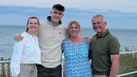 Isaac Wilton (second left) with his sister and parents