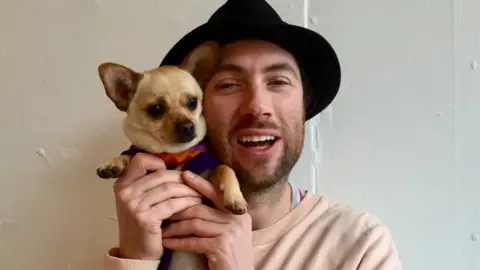 The Cause Stuart Glen with puppy