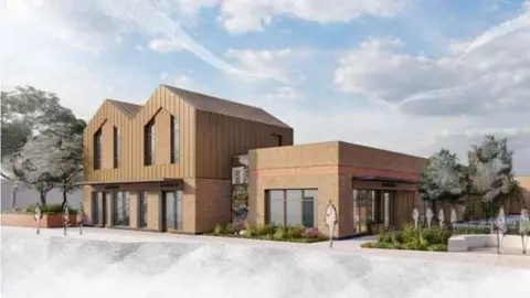 Local Democracy Reporting Service A drawing of the Dinnington regeneration. It shows to connected red brick buildings. The building on the left has wooden panels on the top half exterior. Both buildings have glass doors and windows. There are trees on the left and right of the building. The sky is blue with light white clouds. 