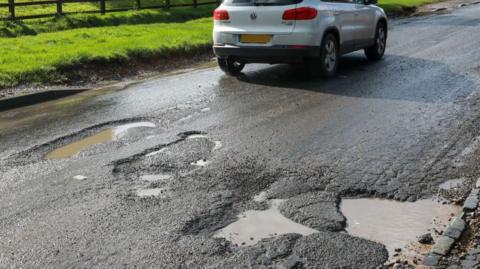 A potholed road