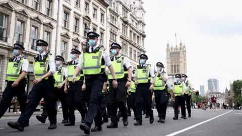 Reuters Police at a Covid demonstration