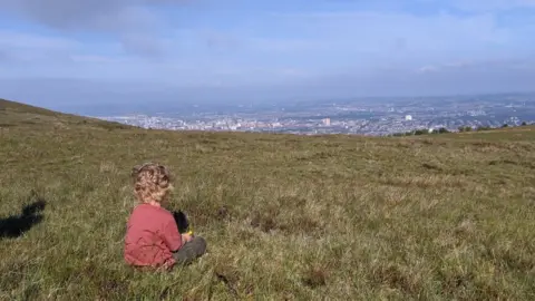 Seaneen Molloy Oisín at the top of Divis mountain