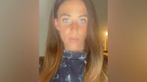 Met Police Charlotte Lawlor takes a selfie, she has long light brown hair and blue eyes.