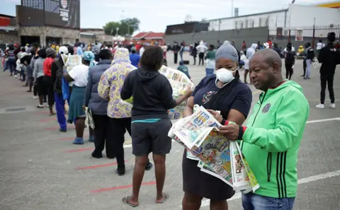 Siphiwe Sibeko / Reuters Queue outside a shop