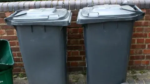 BBC Two black wheelie bins