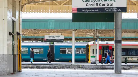 Barcroft Media/Getty Images Very few passengers at Cardiff Central