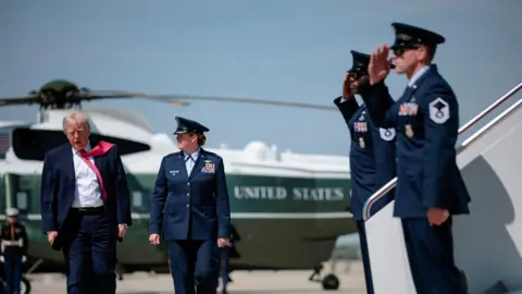 Reuters U.S. President Donald Trump's tie is blown by the wind as he walks to board Air Force One for his trip to Las Vegas, Nevada, as he departs Joint Base Andrews, Maryland.