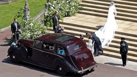 REX/Shutterstock Meghan Markle arriving at her royal wedding ceremony