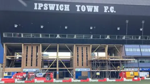 Luke Deal/BBC Work taking place at Portman Road below Ipswich Town sign