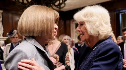 PA Media Queen Camilla (right) greets Anna Wintour during a visit to the New York Public Library to celebrate literature,