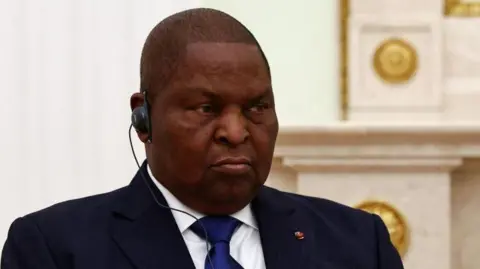 President of the Central African Republic Faustin-Archange Touadera  in a blue suit and white shirt