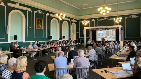 BBC A chamber full of councillors 