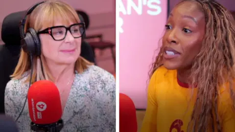 Woman wearing glasses and headphones in front of red microphone looking towards another woman wearing a yellow t-shirt in front of a similar microphone.