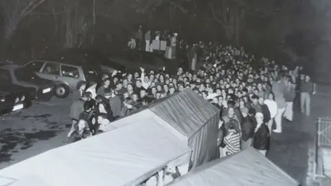 Rachel Jones Queue of people waiting to enter the club