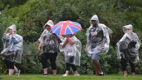 Getty Images Visitors walk through the Kensington Palace gardens on the anniversary of Diana's death