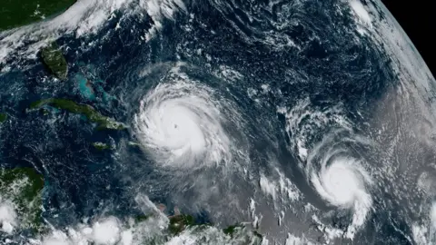 PA A satellite image shows Hurricane Irma (left) and Hurricane Jose (right) in the Atlantic Ocean, 7 September 2017