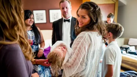 Jez Dickson Carly holding her daughter