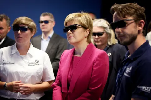 Jane Barlow / Reuters Scotland's First Minister Nicola Sturgeon wearing 3D glasses
