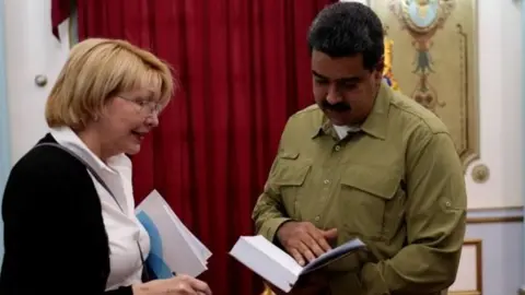 Reuters Venezuela's chief prosecutor Luisa Ortega Diaz, Venezuela's President Nicolas Maduro and Jorge Rodriguez, mayor of Caracas, attend a meeting at Miraflores Palace in Caracas, Venezuela April 1, 2017.