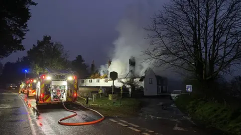 Anna Louise Claydon/BBC Fire at a property in Hengrave, Suffolk