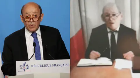 Getty Images Jean-Yves Le Drian (L) and his impersonator