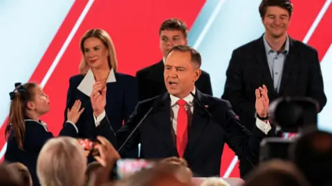 Getty Images Karol Nawrocki addresses a crowd on election night.