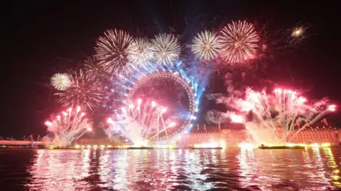 PA Media Fireworks light up the sky over the London Eye in central London during New Year celebrations.