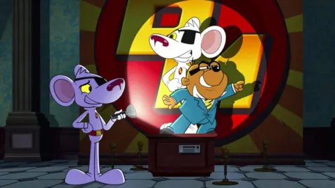 A cartoon of Danger Mouse, a white mouse with a black eye patch and a red belt, shining a torch on a picture of himself and his sidekick Penfold, a brown hamster with black glasses dressed in a blue suit, white shirt and yellow tie