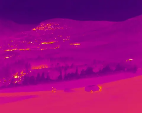 Cairngorms National Park Authority A thermal image of the Cairngorms showing areas of the park which are still burning.