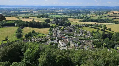 Beatriz Gonçalves A view of the town of Nibley in Gloucestershire, showing houses and trees