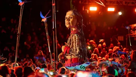 The Walk Productions Amal at crowded event 