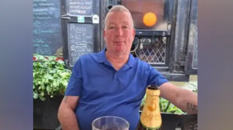 Leicestershire Police Man in a blue T-shirt
