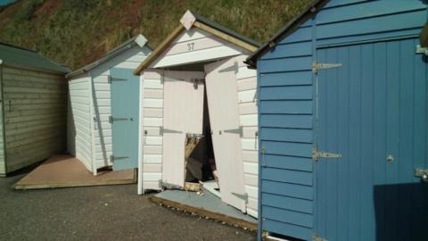Damaged beach huts