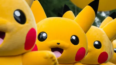 Pokemon mascot outfits, several of them, all in a row