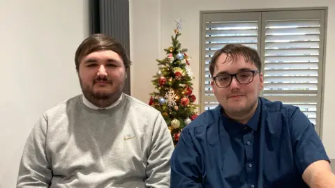 Daniel, 27, wearing a grey Nike jumper and Jack, 29, in a blue shirt