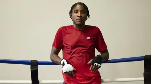 IOC Cindy Ngamba leaning on boxing ring