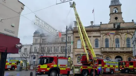 Leicestershire Fire and Rescue Service Fire service at a fire in Loughborough town centre in March 2023