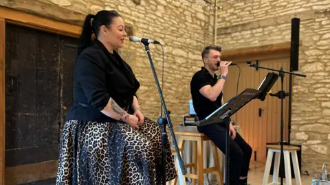 Helen and Douglas House Singer Kiki Deville (left) and songwriter Angus Powell (right) put the songs together.