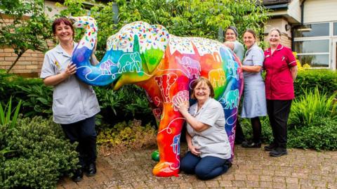 Elephant sculpture with nurses