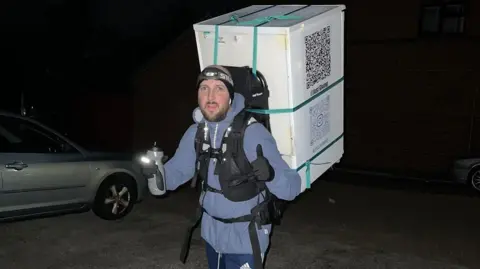 Daniel Fairbrother man carrying fridge