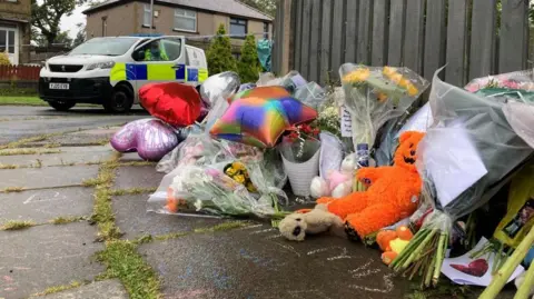 Charles Heslett/BBC Tributes left at the scene